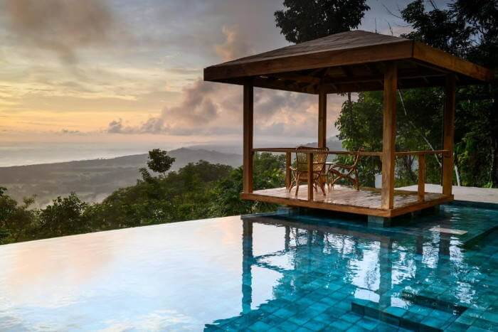 infinity pool overlooking sunset on the pacific